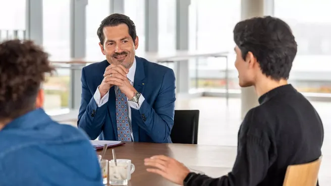 President Thomas F. Hofmann in conversation with students