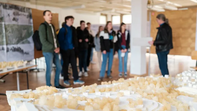 Prospective students in the exhibition of final theses